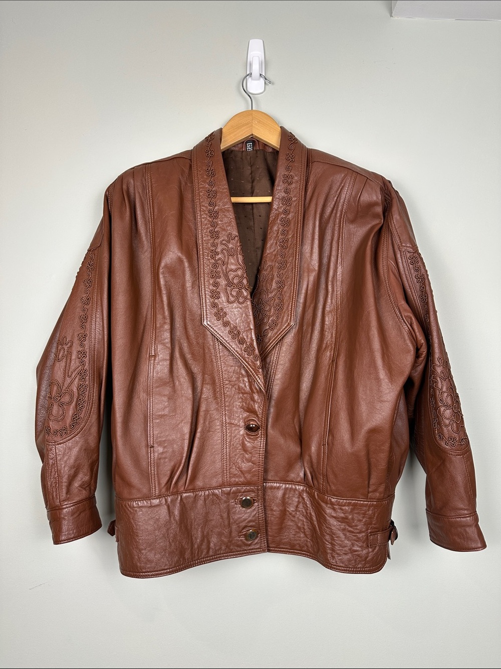 2. vintage embroidered leather brown jacket.